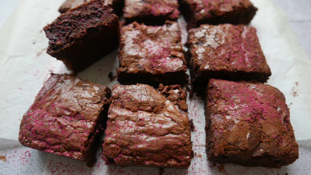Fudgy chocolate brownies dusted with raspberry powder
