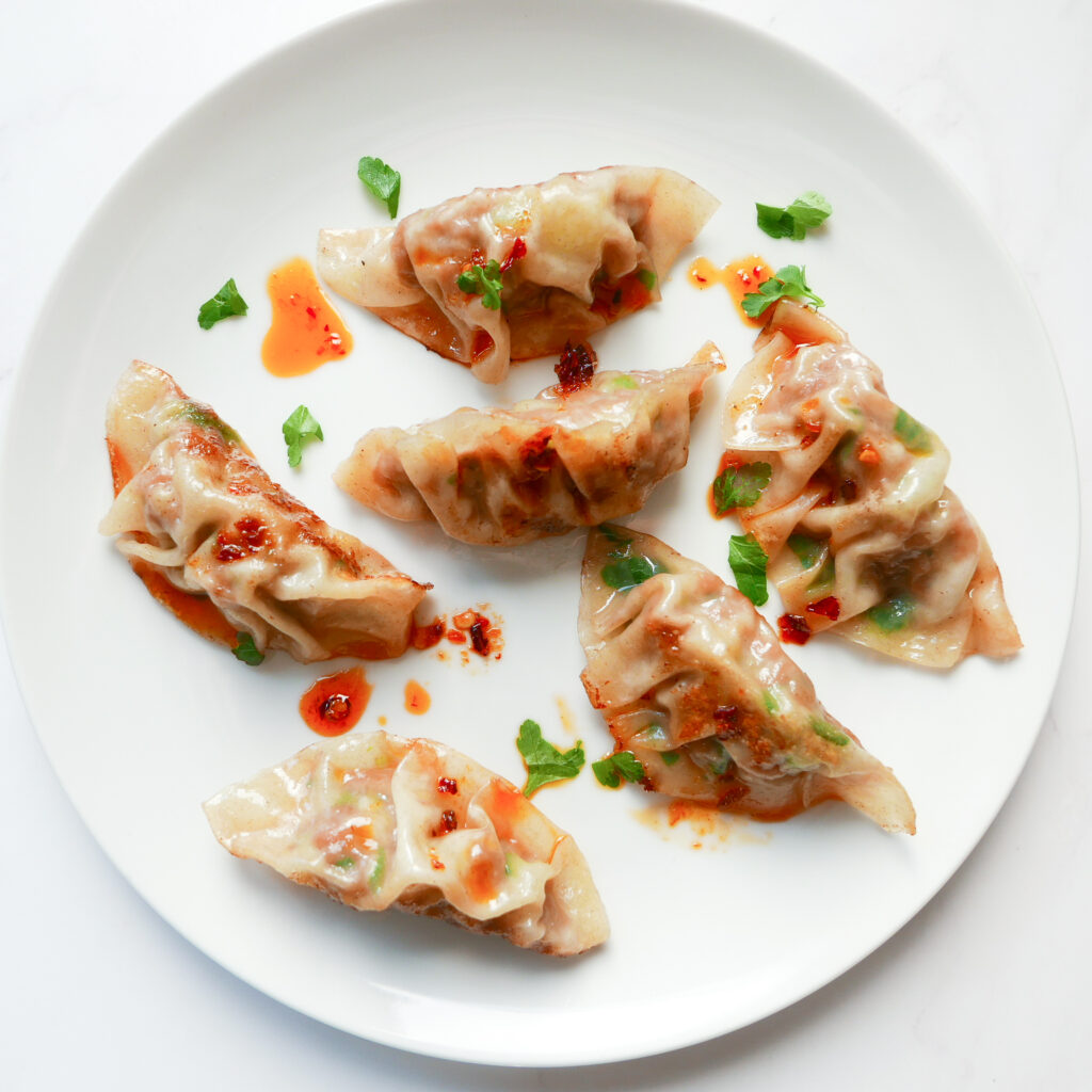 Chinese pork dumplings with chilli sauce