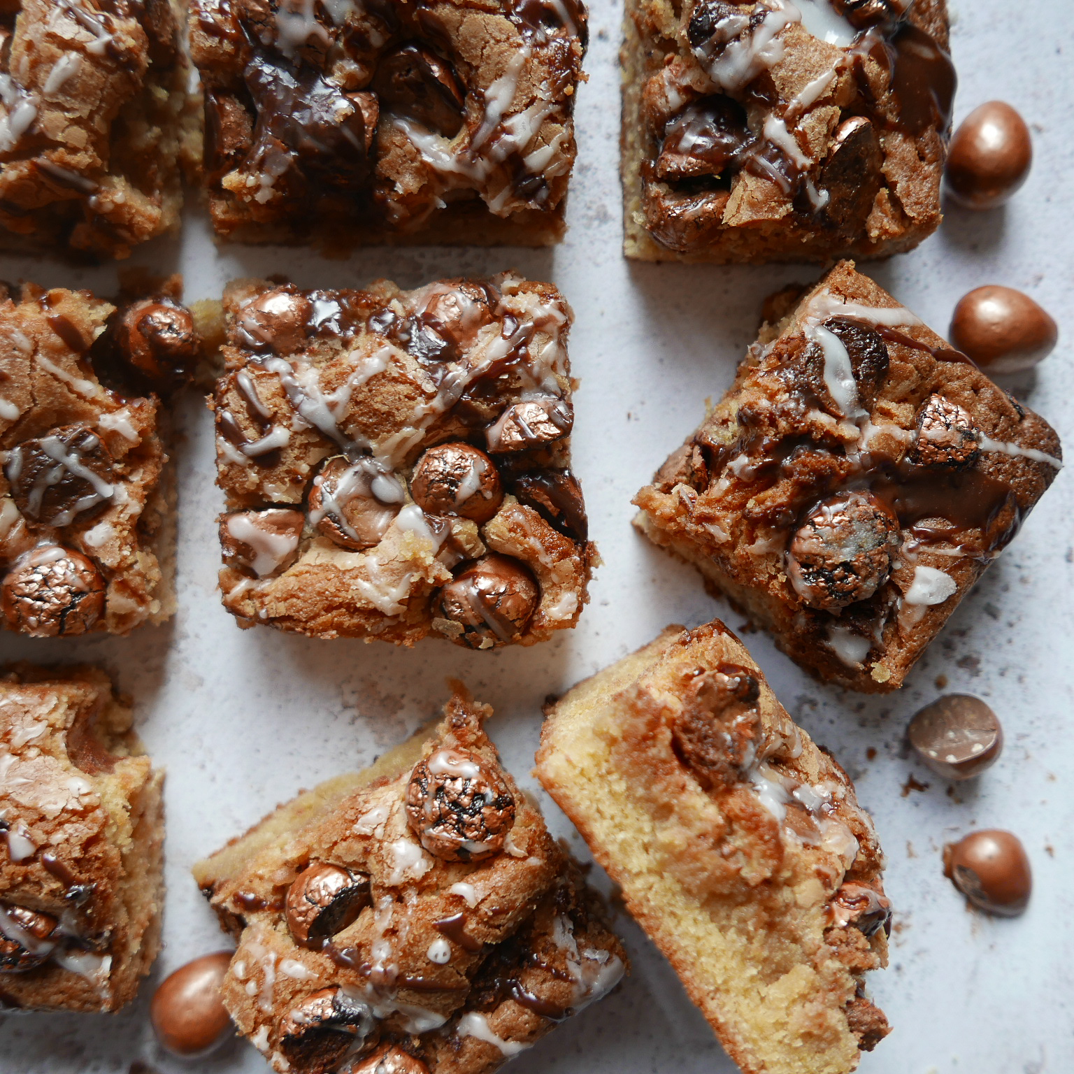 Easy blondies with Galaxy chocolate eggs drizzled with Nutella