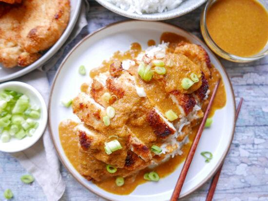 chicken katsu curry with rice and spring onions