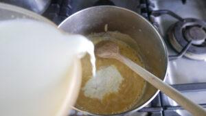 adding milk to flour and butter - Cook Simply