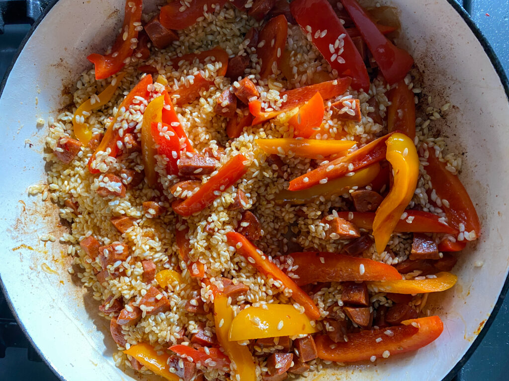 Paella rice mixed with chorizo and peppers - Cook Simply