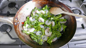 stir frying prawns and broccoli - cook simply