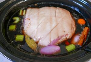 Pouring the cola in the slow cooker - Cook Simply