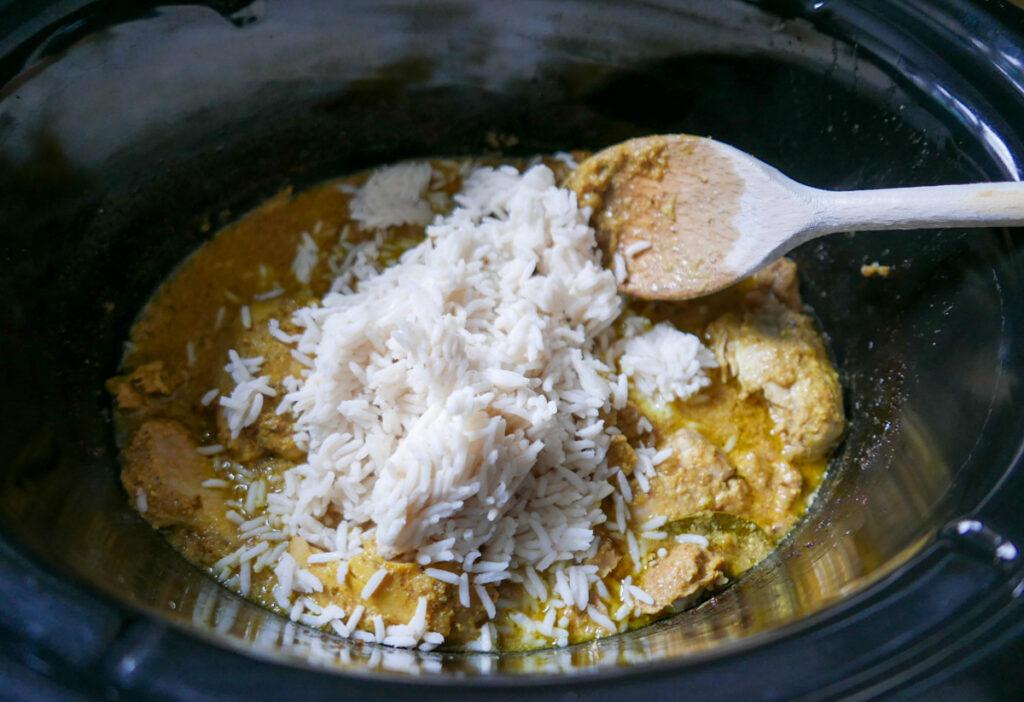 adding rice to biryani - cook simply
