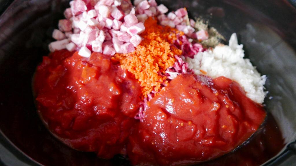 Ingredients including pancetta, carrots, onions and tinned tomatoes - Cook Simply