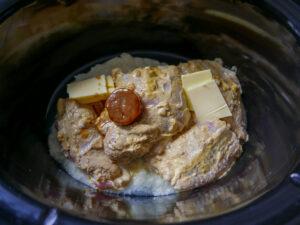 adding biryani ingredients to slow cooker - cook simply