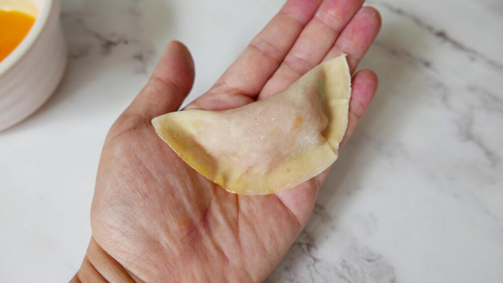 Wrapping a chicken dumpling - Cook Simply