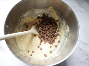 adding chocolate chips to banana bread batter - Cook Simply