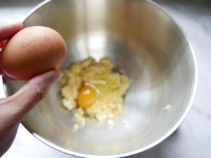 adding eggs to banana bread batter - Cook Simply