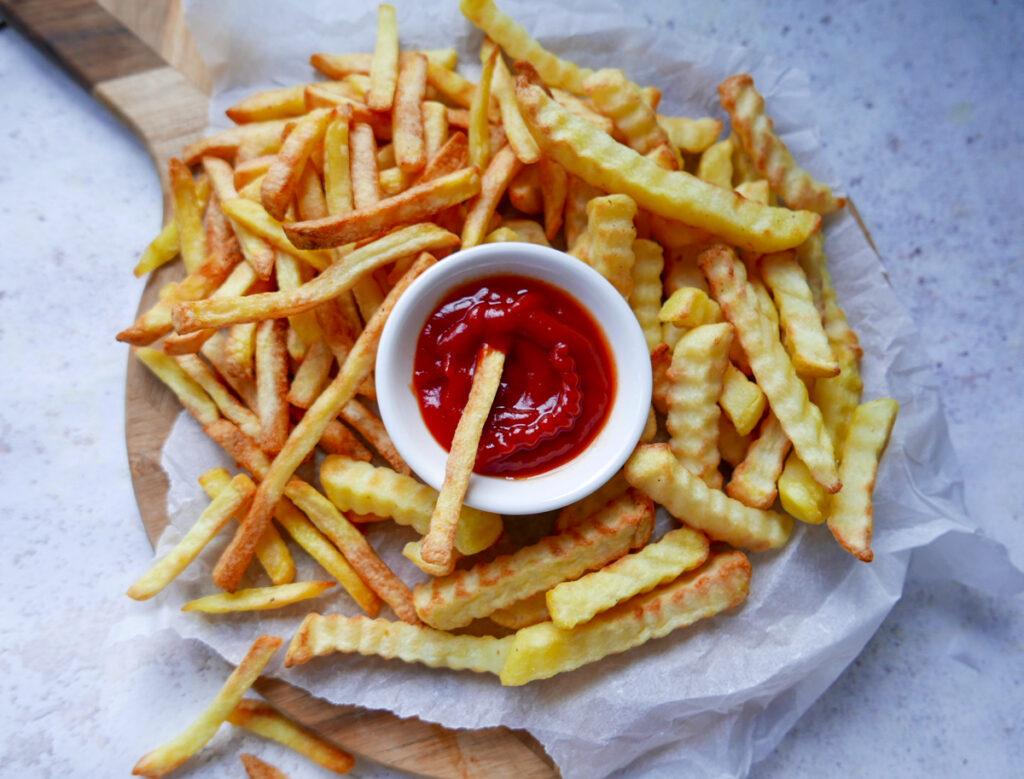 Air fried frozen French fries with tomato ketchup - Cook Simply