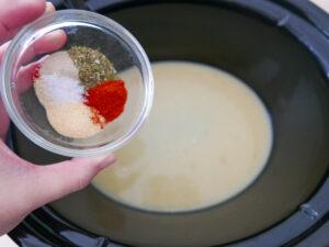 Adding herbs and aromatics to slow cooker marry me chicken - Cook Simply