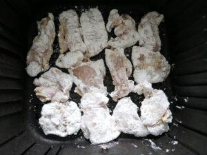 Chicken pieces coated in cornflour in a single layer - Cook Simply