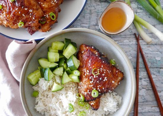 air fryer honey garlic chicken thighs sprinkled with sesame seeds and spring onions