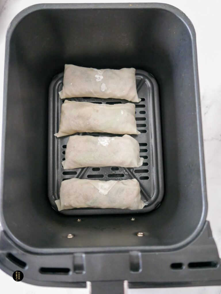Spring rolls in an air fryer basket - Cook Simply