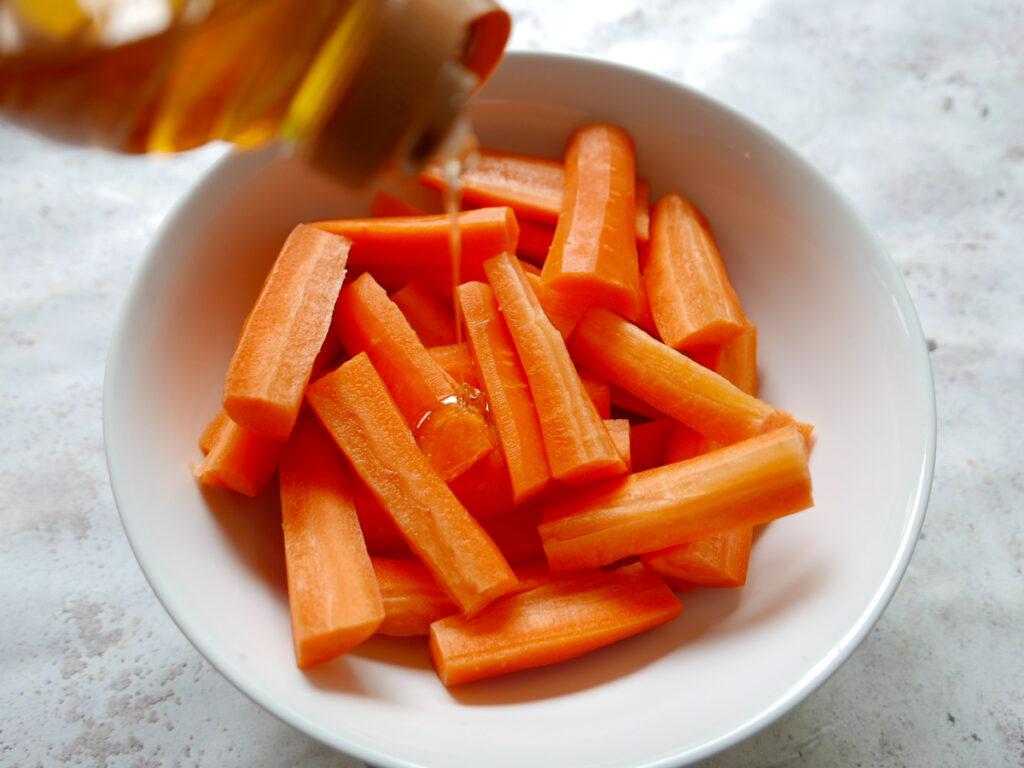 Adding honey to carrots  - Cook Simply