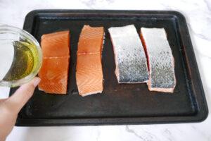 Adding olive oil to salmon fillets - Cook Simply