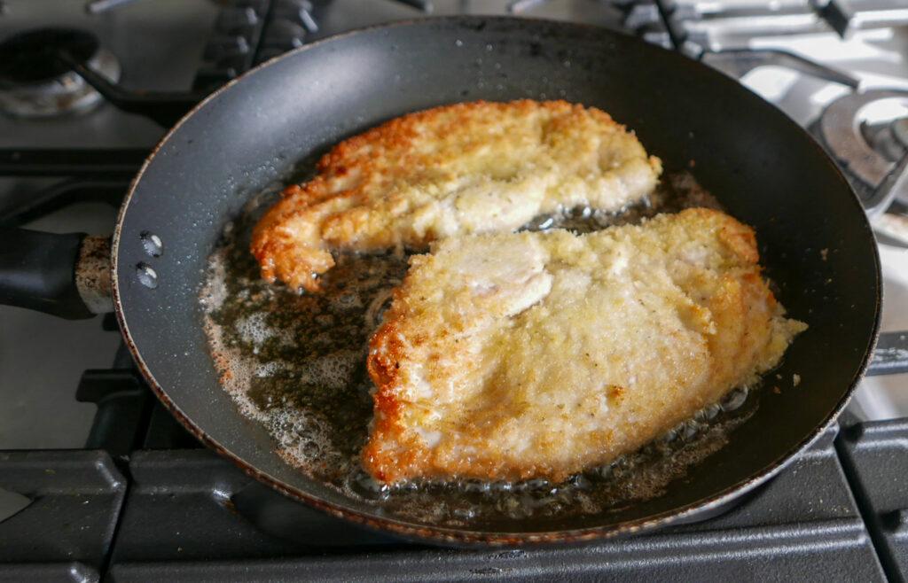Pan frying chicken escalopes in oil - Cook Simply