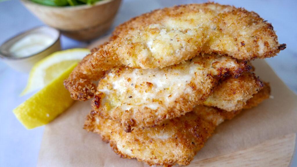 Crispy chicken escalopes with lemon wedges - Cook Simply